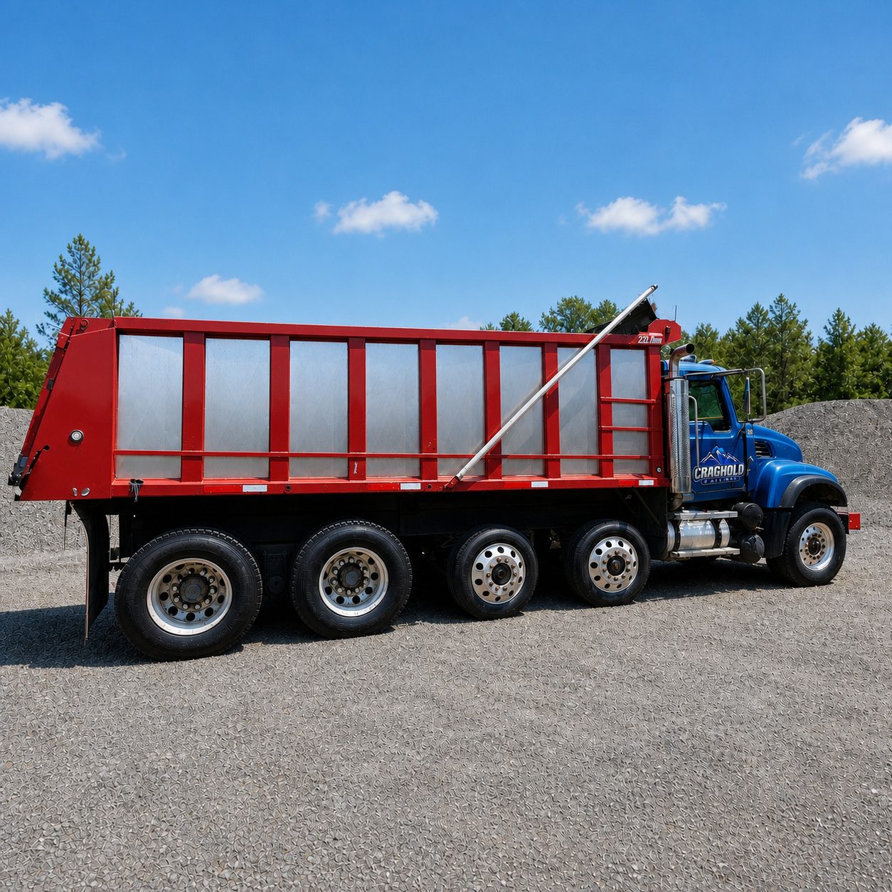 Craghold Hauling dump truck with red bed and blue cab, shown from the side to highlight hauling capacity